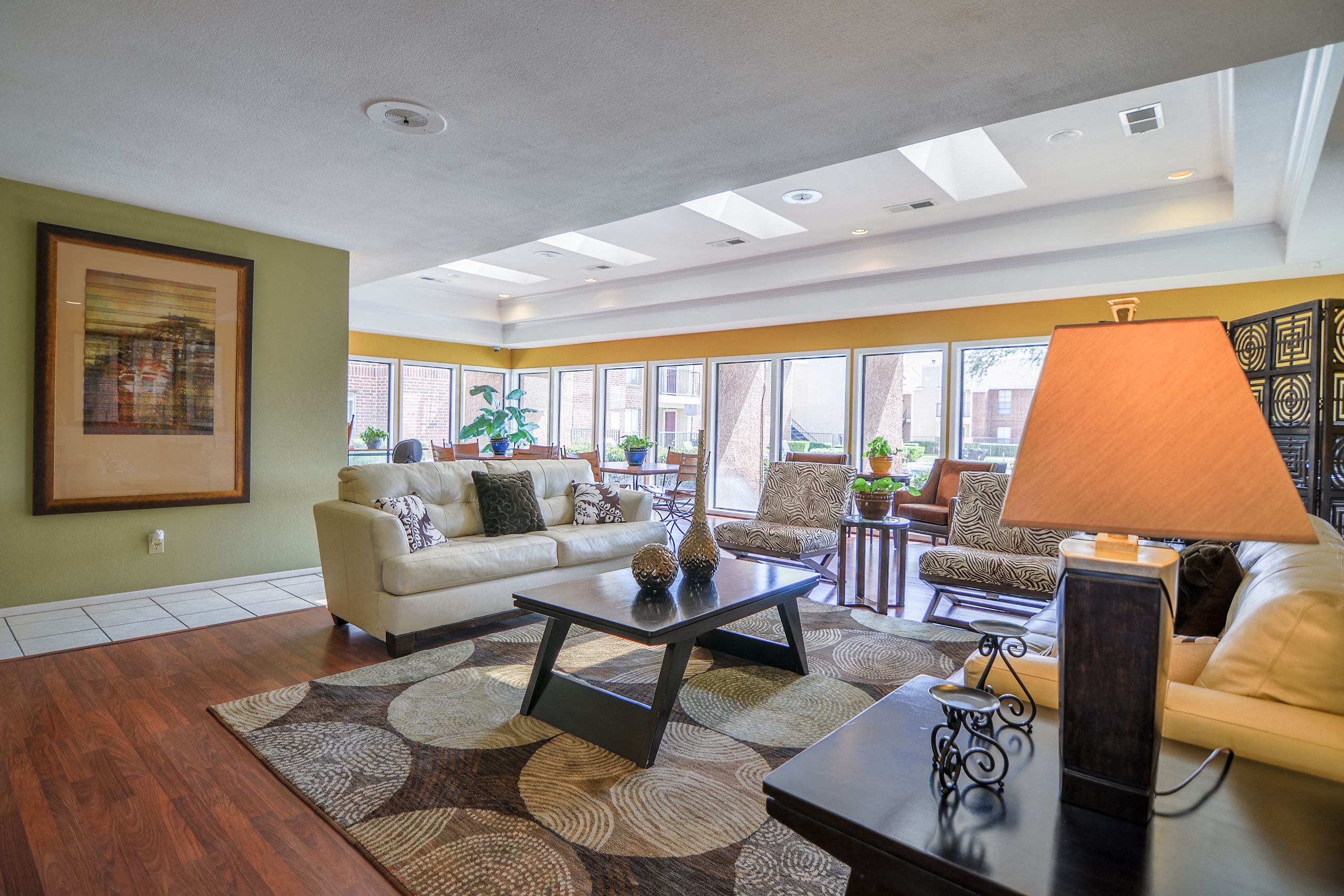 A shared, open space with tables and chairs for resident use