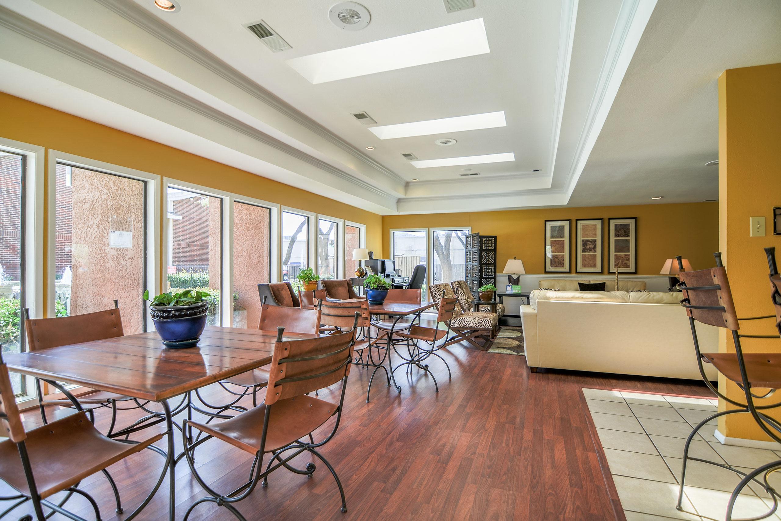 A shared, open space with tables and chairs for resident use