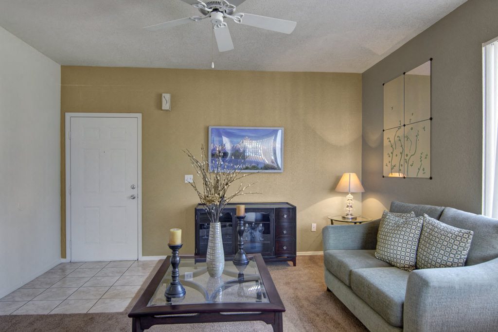 Arezzo Apartments- furnished large living room with ceiling fan 