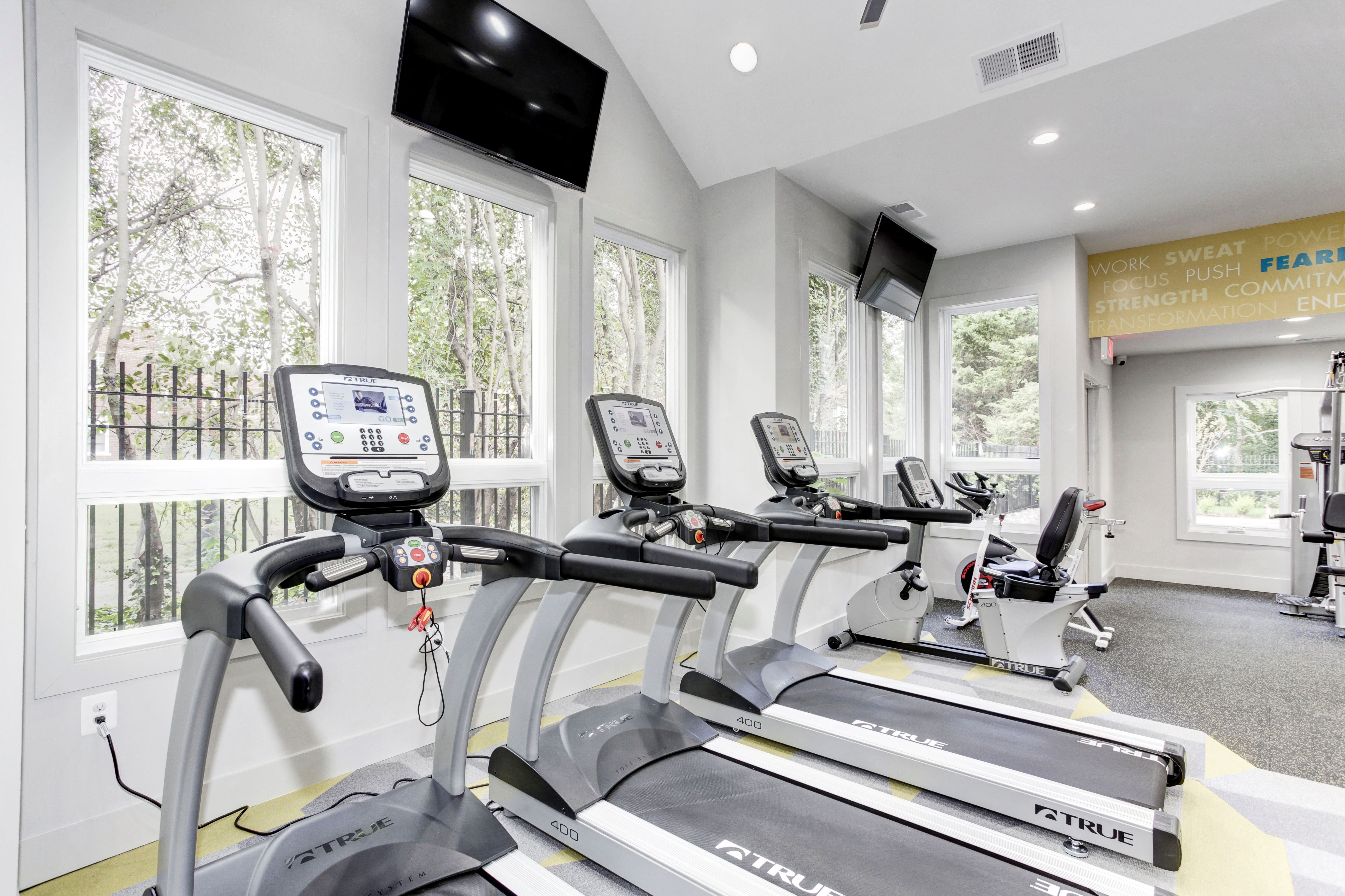 24-Hour Fitness Center with Cardio Machines, Free Weights, and Yoga Area