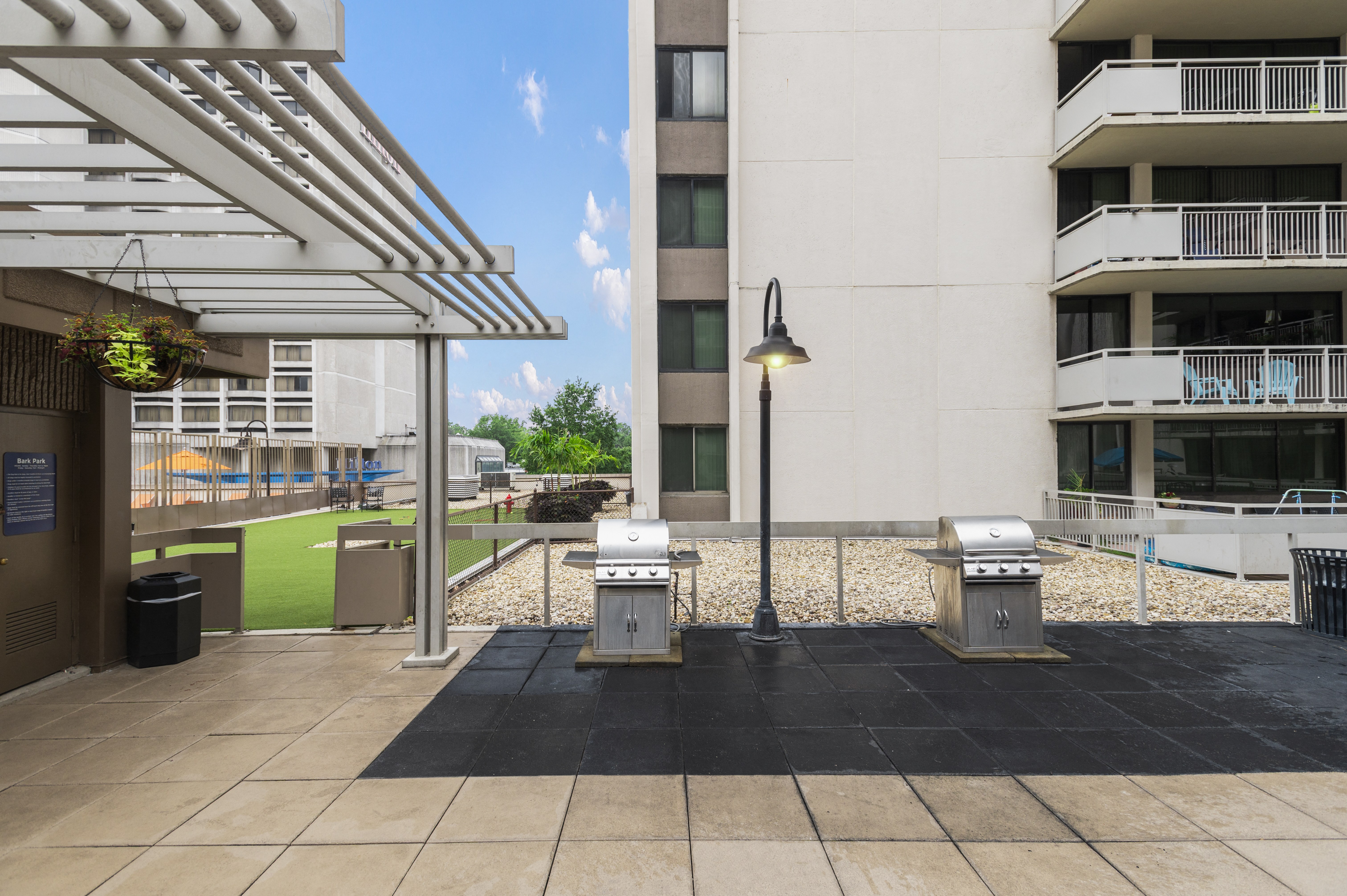Beautifully Landscaped Courtyard with Gas Grills