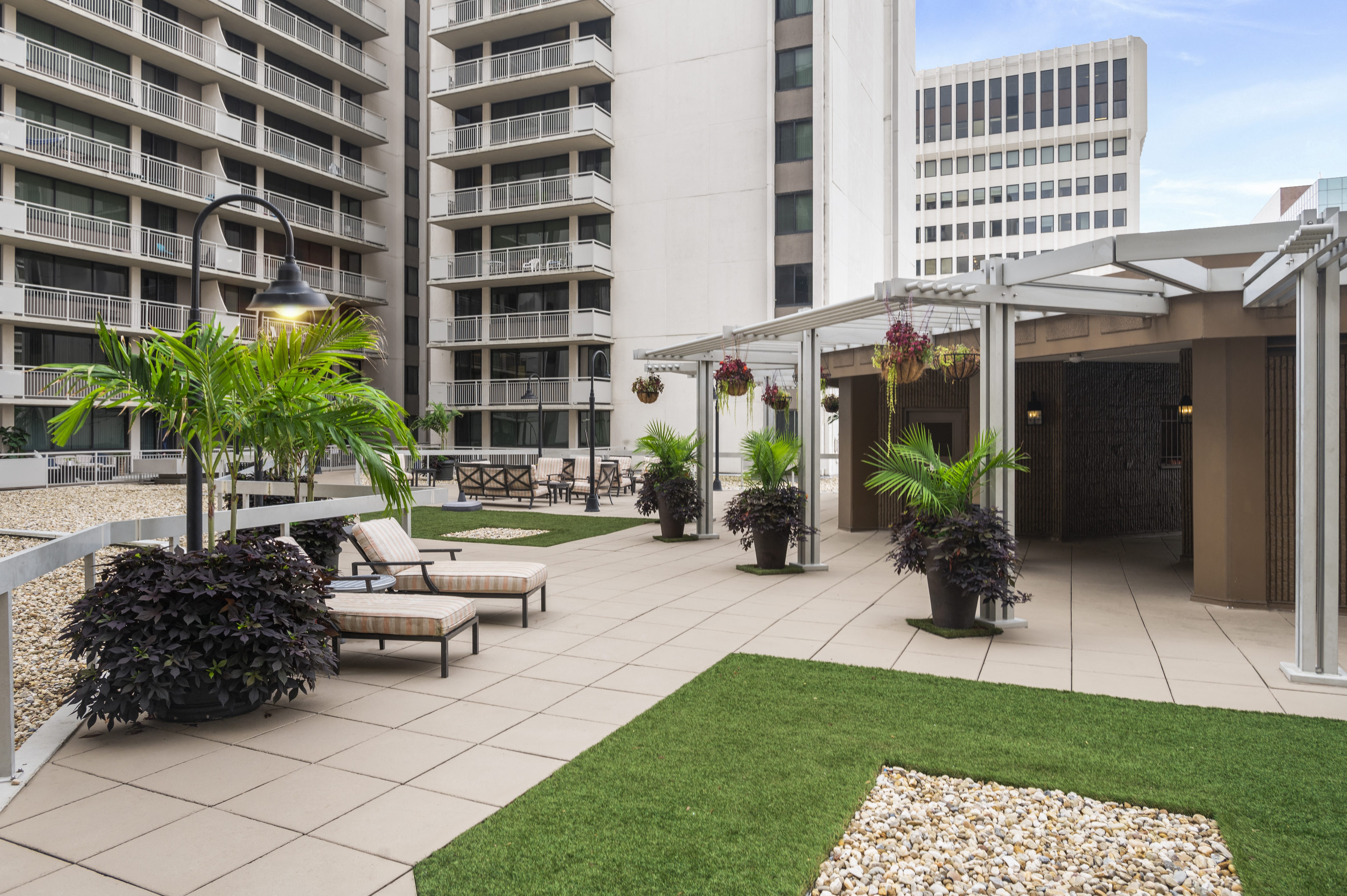Beautifully Landscaped Courtyard with Gas Grills