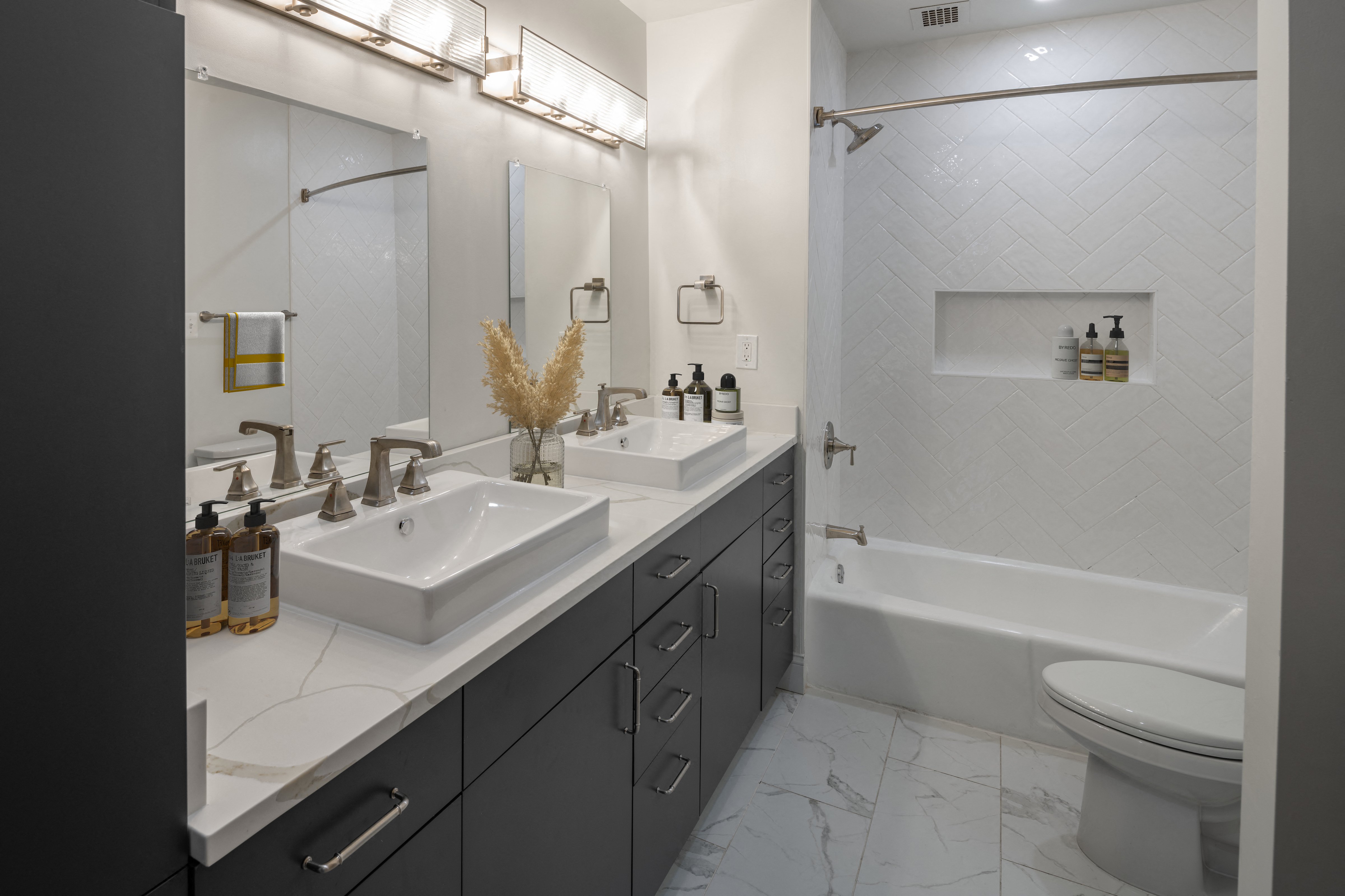 Premium Gold Finish - spa-inspired bathrooms with crafted tile and dual vanity sinks (in select homes)