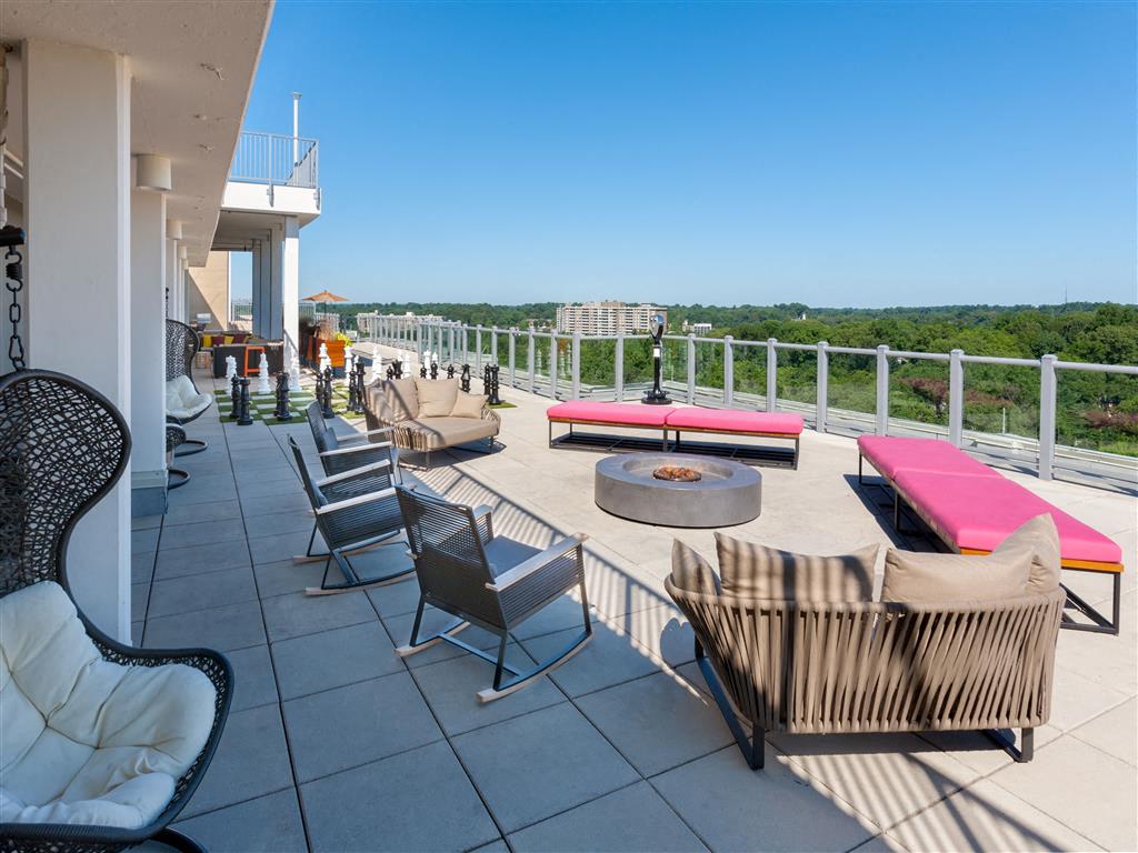 Rooftop Deck Features Sparkling Pool & Sundeck, a Tennis Court, Lounge Seating and Outdoor Games Rooftop Deck Features Sparkling Pool & Sundeck, a Tennis Court, Lounge Seating and Outdoor Games