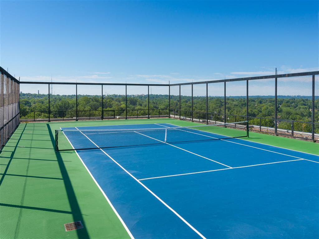 Rooftop Deck Features Sparkling Pool & Sundeck, a Tennis Court, Lounge Seating and Outdoor Games Rooftop Deck Features Sparkling Pool & Sundeck, a Tennis Court, Lounge Seating and Outdoor Games
