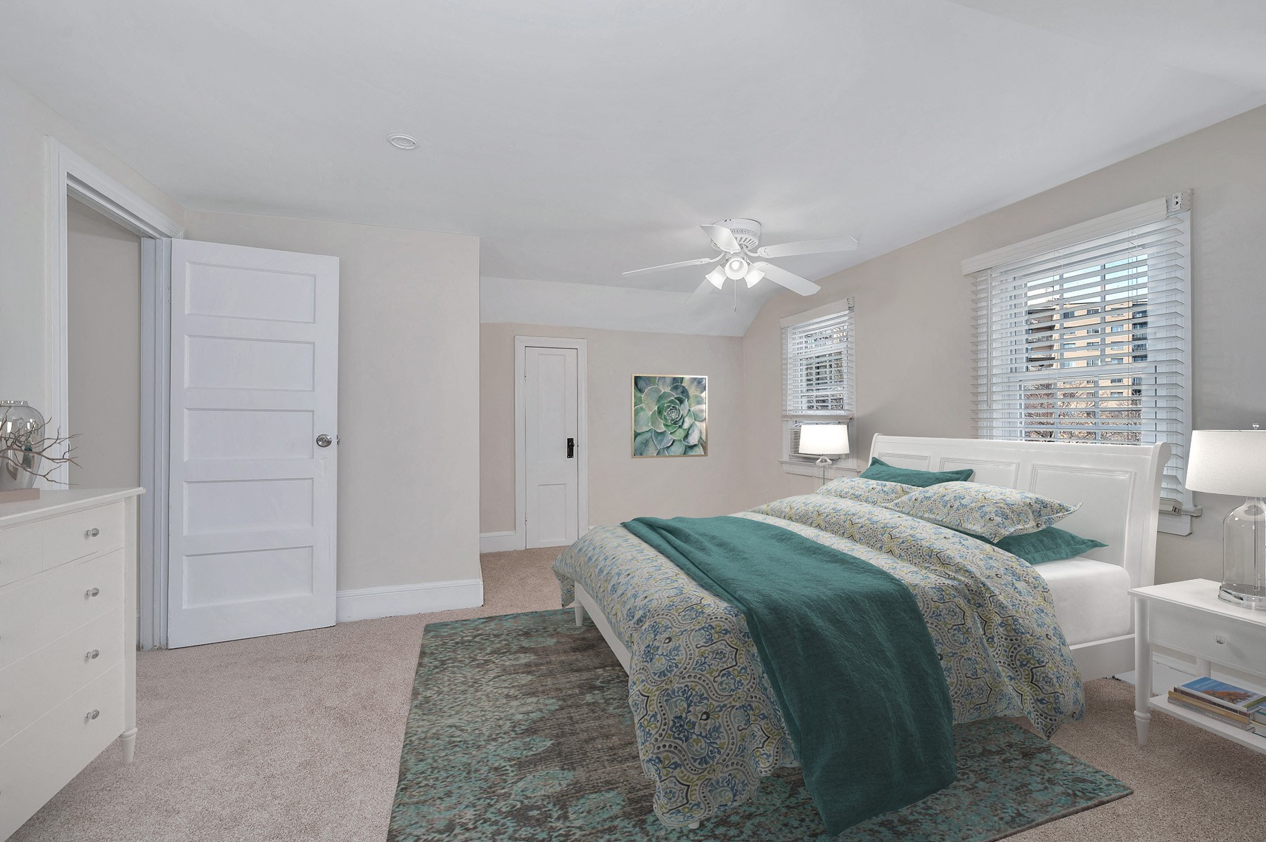King size bedroom with ceiling fan