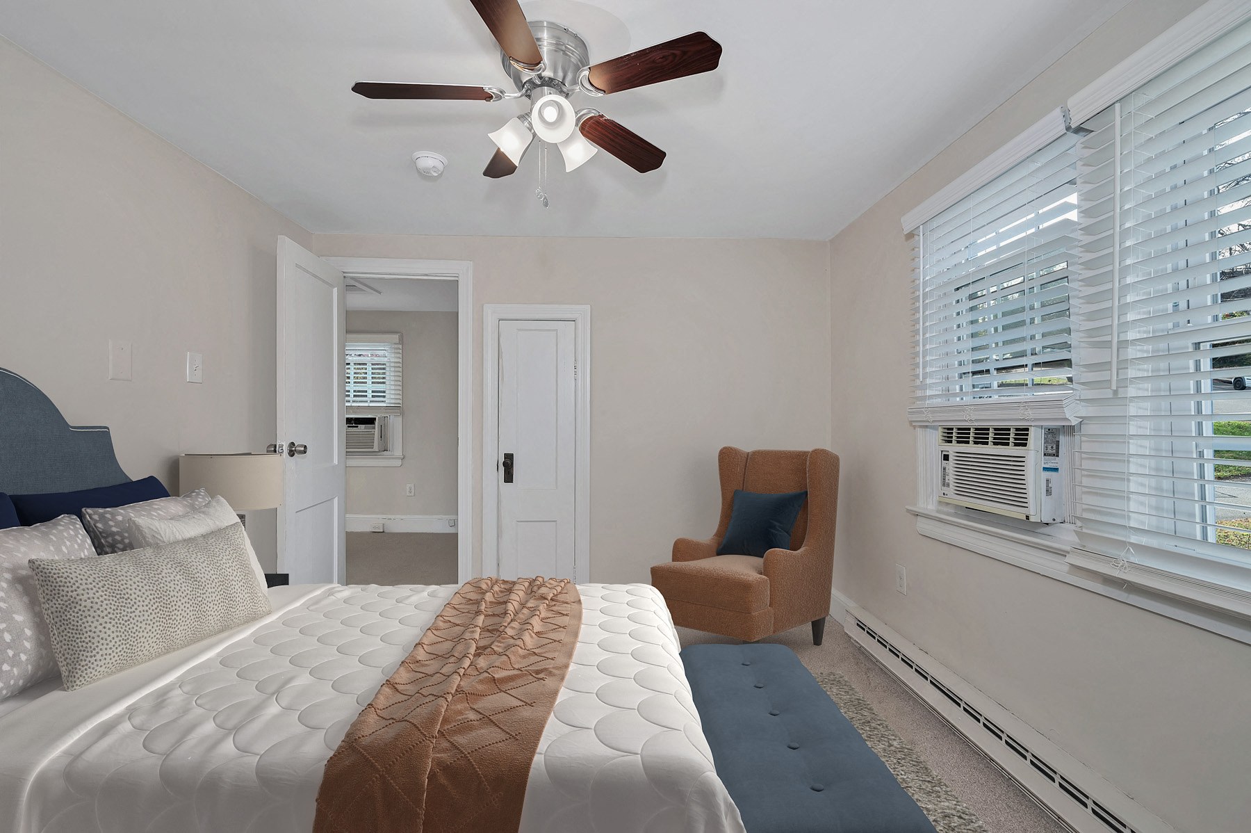 Queen size bedroom with ceiling fan