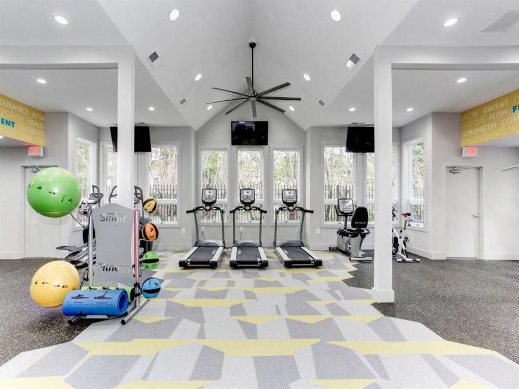 24-Hour Fitness Center with Cardio Machines, Free Weights, and Yoga Area