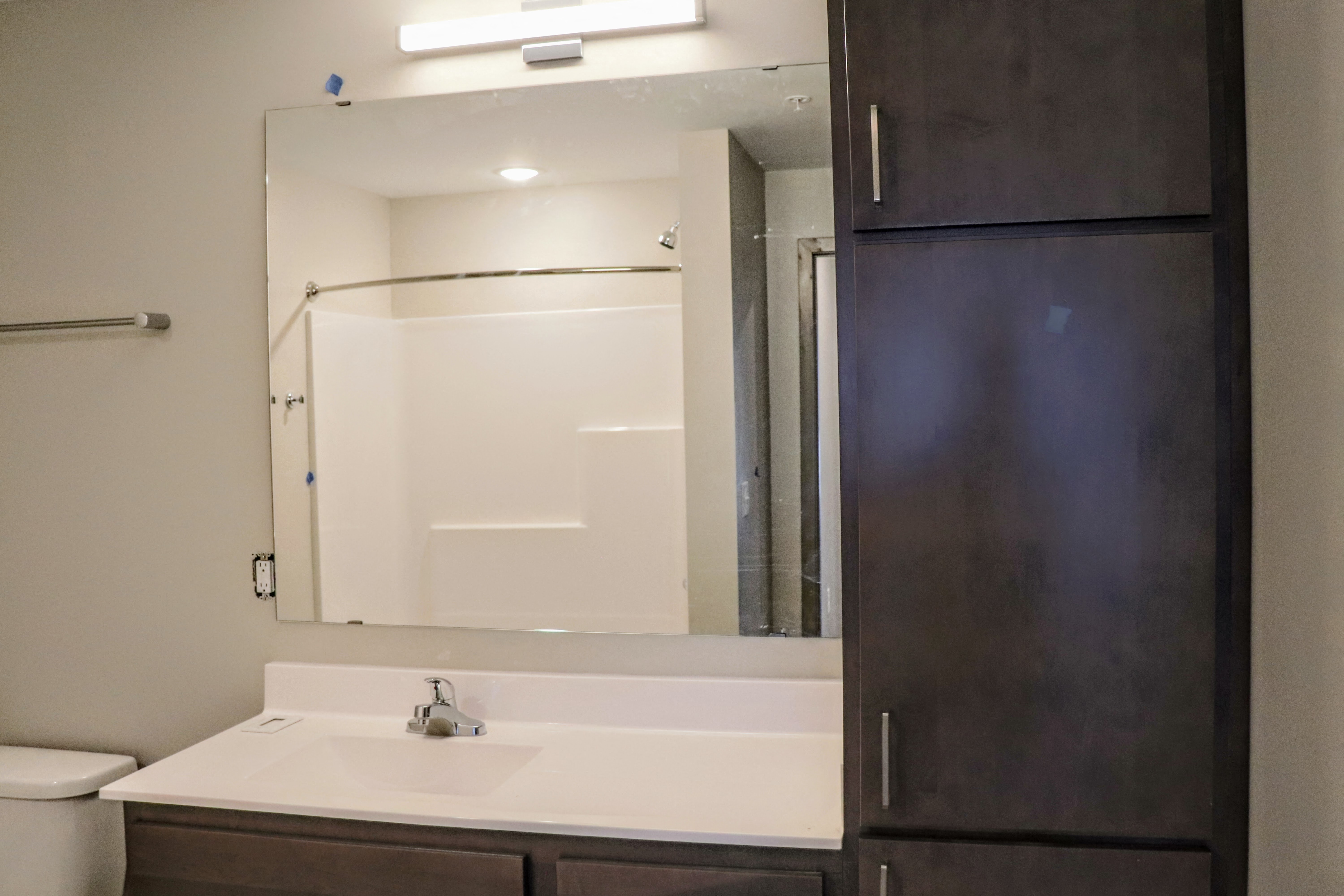 Open and airy shower and vanity spaces.