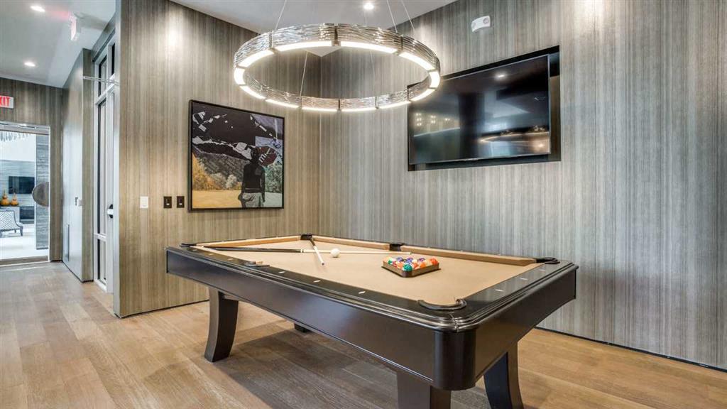 Game room with TVs for entertaining.