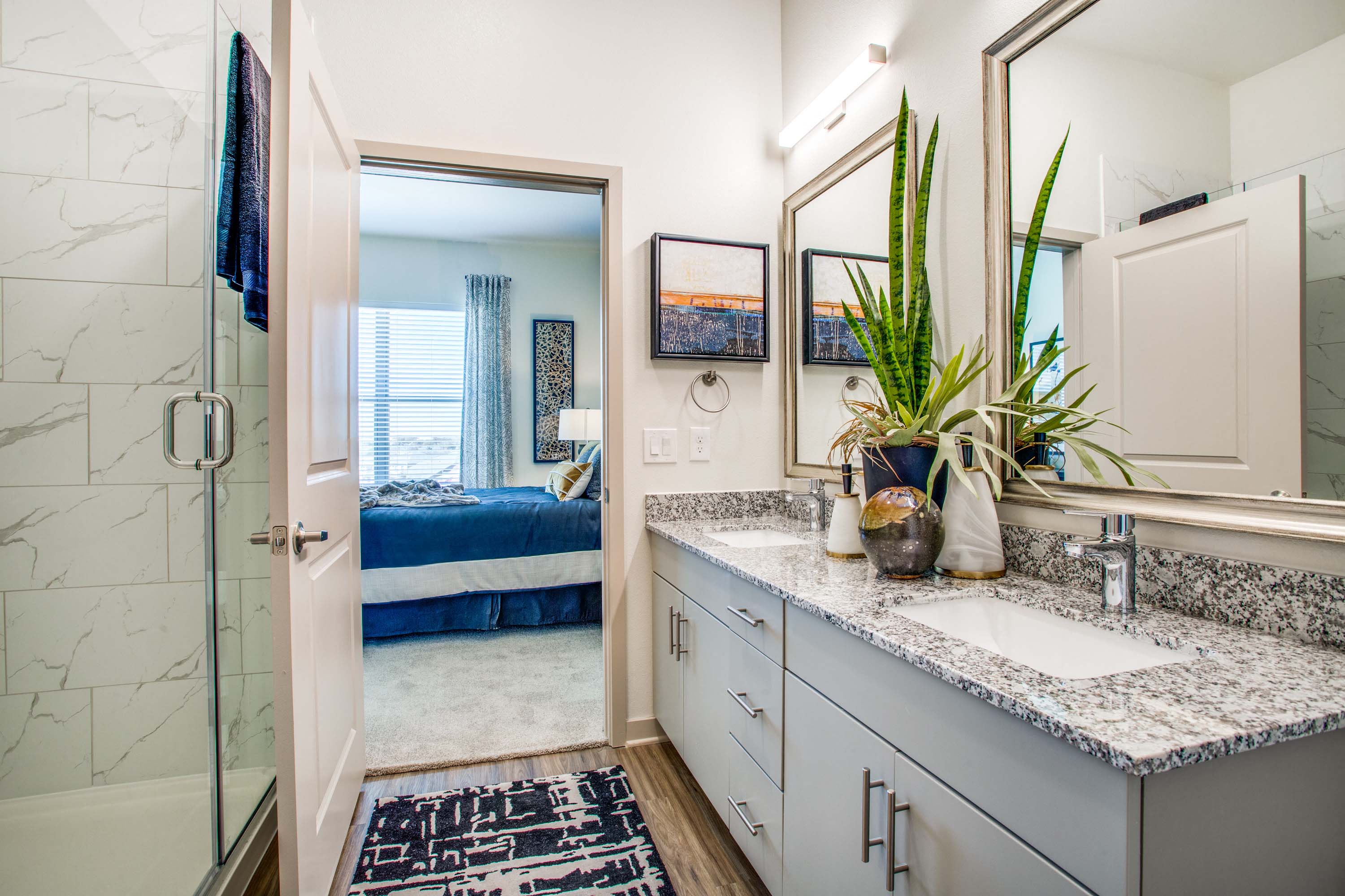Large bathroom with double-vanity and walk-in shower