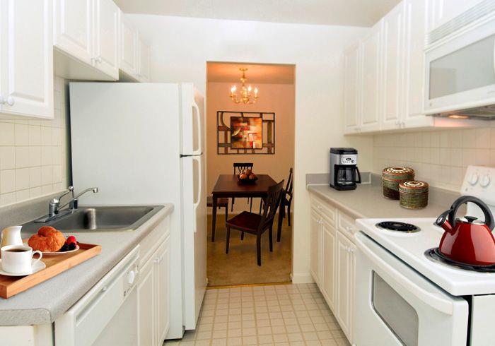 Kitchen with White-on-White Cabinetry and Appliances Kitchen with White-on-White Cabinetry and Appliances