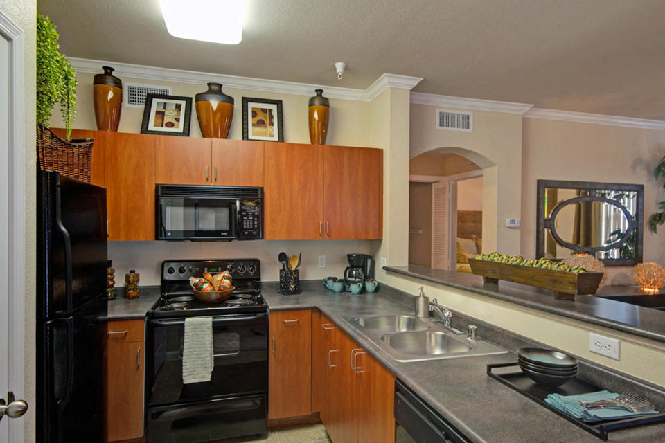 Rich cherry cabinets give your kitchen an elegant feel