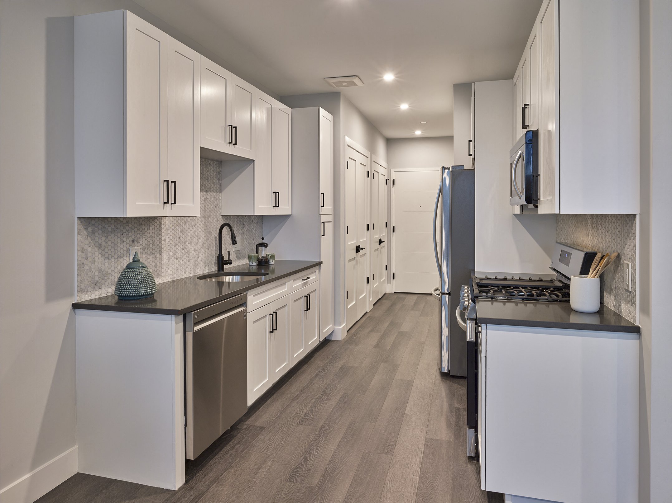 spacious kitchen, full size appliances, stainless steel appliances, hardwood flooring