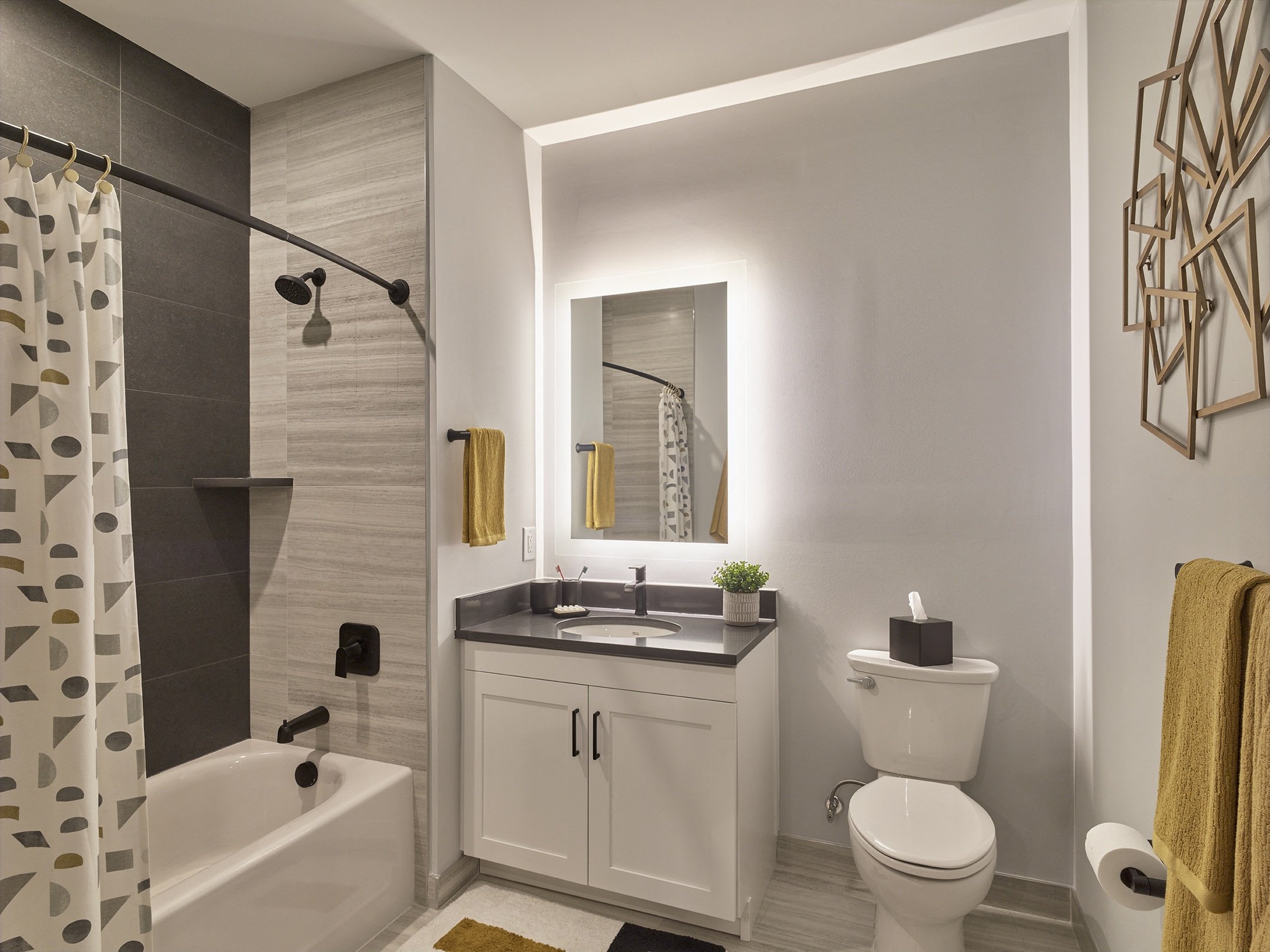 spa-like bath, tiled shower stall, backlit vanity,