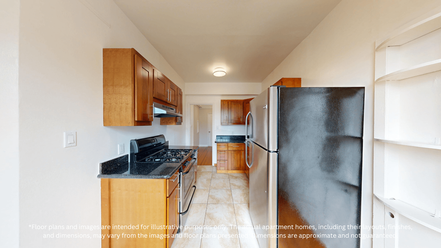 A kitchen with a black countertop and wooden cabinets.