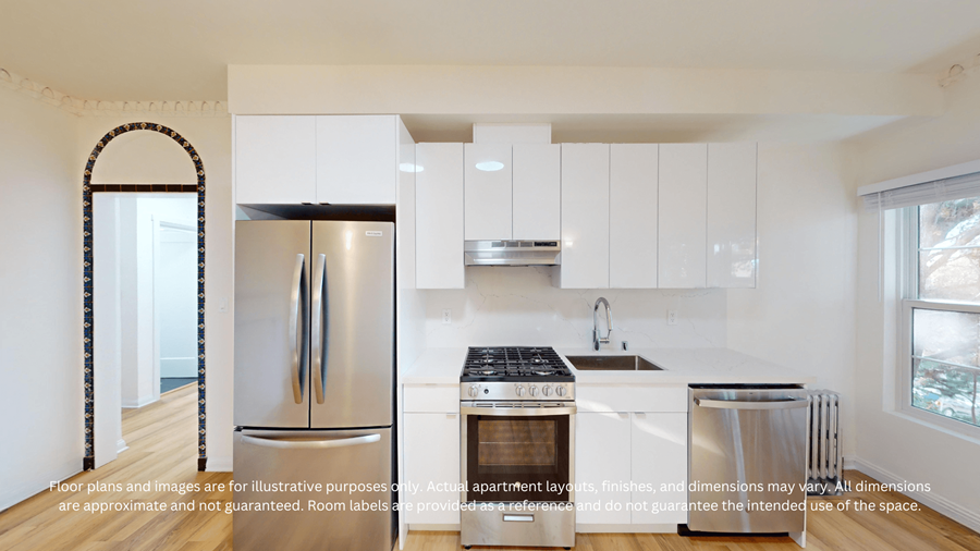 A kitchen with white cabinets and a stainless steel refrigerator.