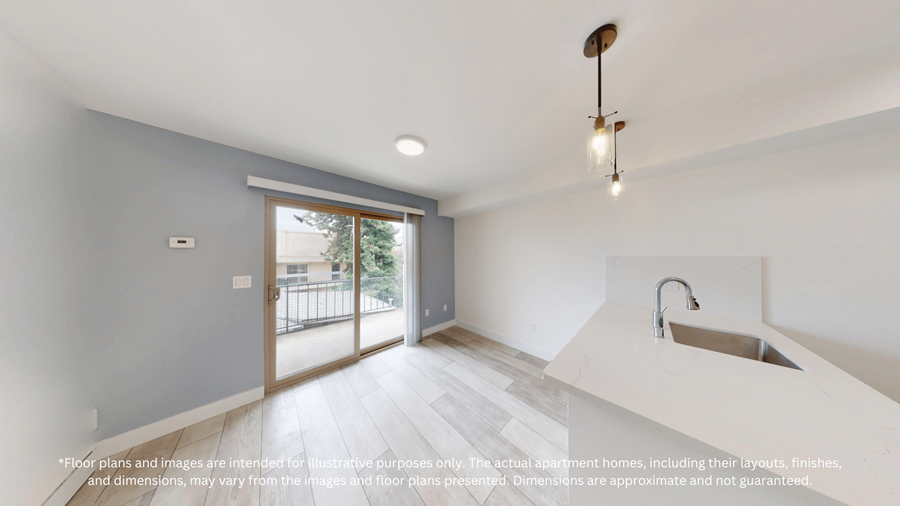 A modern kitchen with a sink and a window.