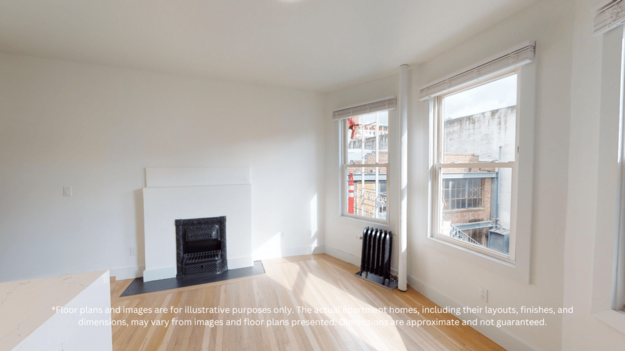 A white room with a fireplace and a window.