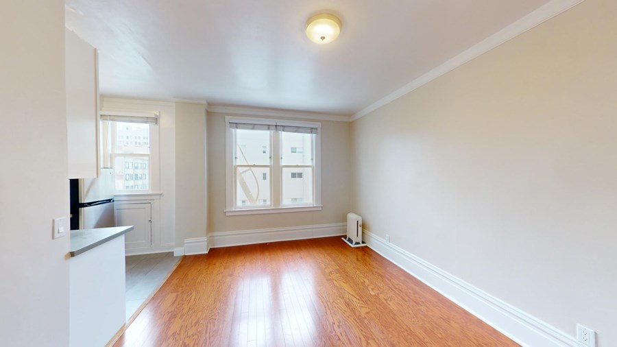 A room with wooden floors and white walls.