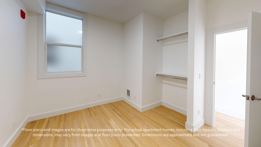 A room with a window and a door.