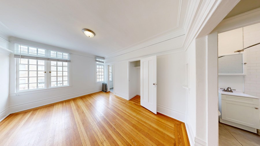 A room with wooden floors and white walls.