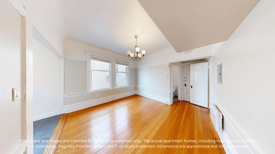 A room with a wooden floor and a chandelier.