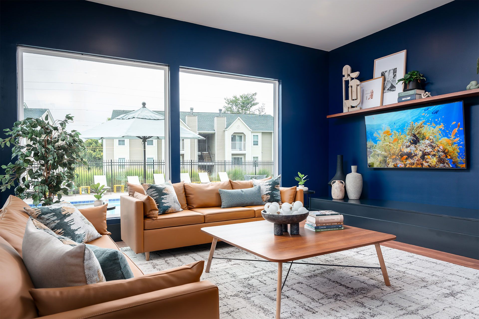 A living room with a brown sofa and a coffee table.
