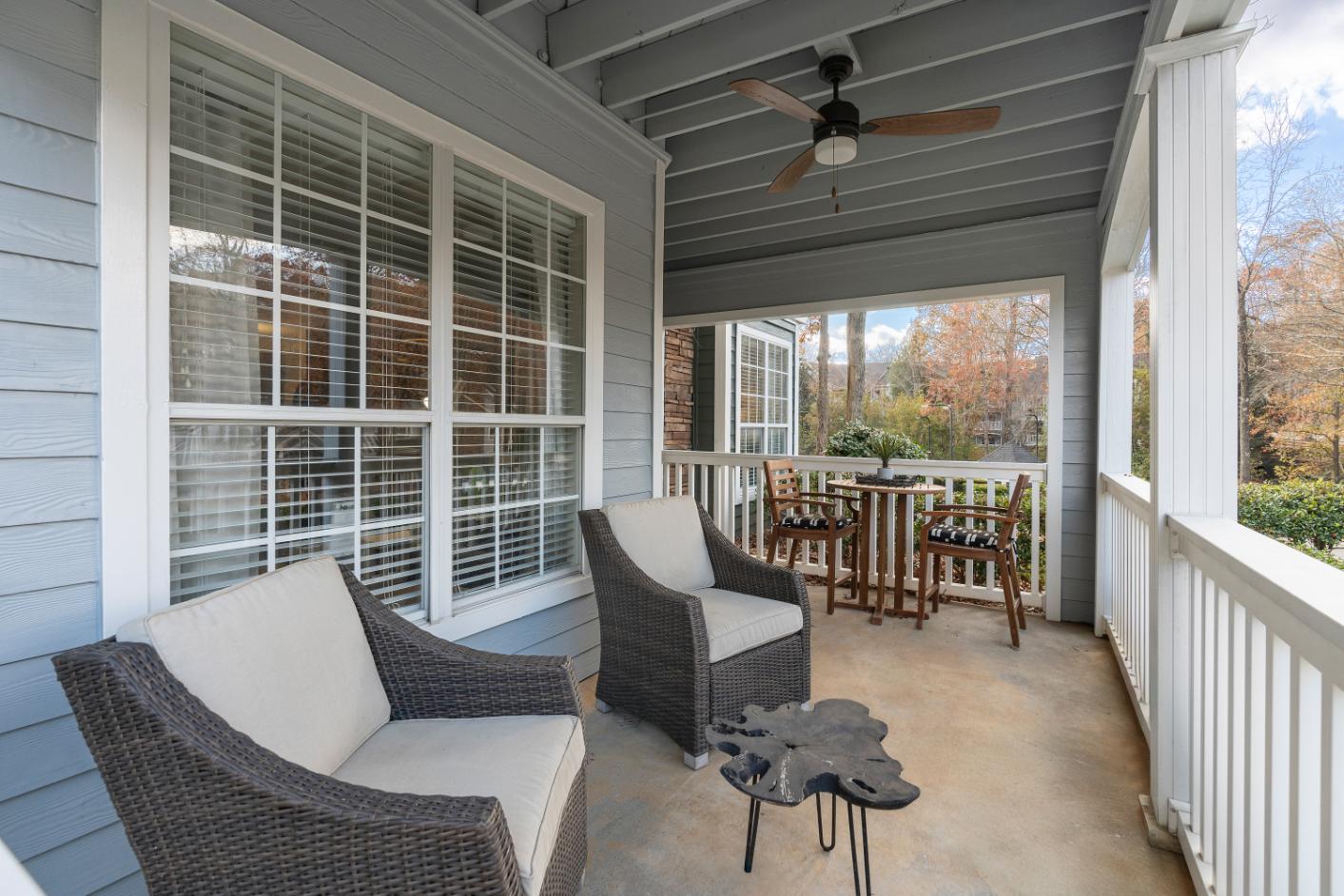 A patio with a table and chairs.