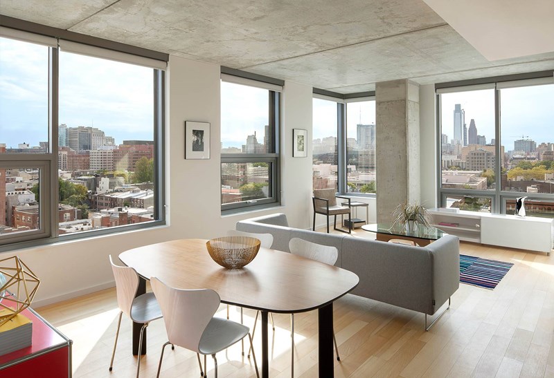 A modern living room with a view of the city.