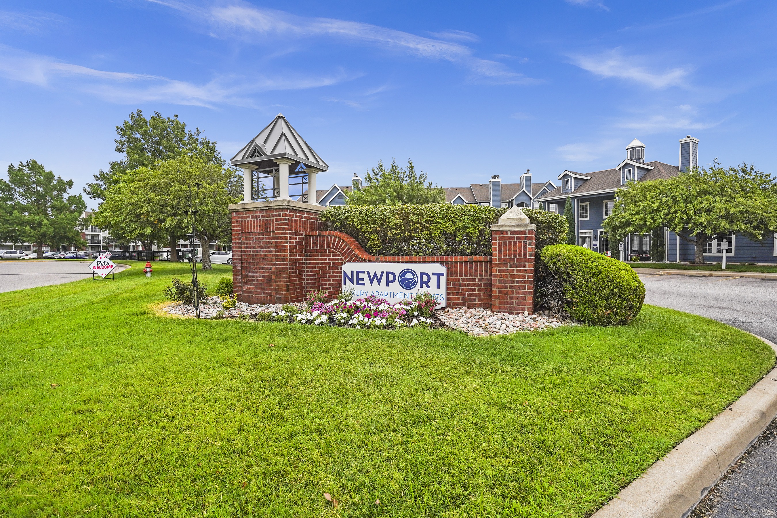 A sign that says Newport is in front of a building.