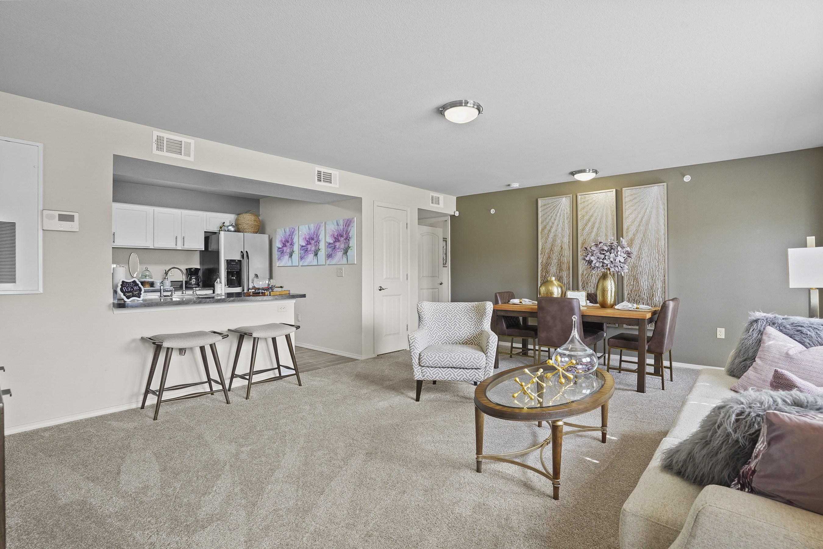 A living room with a couch, chair, and coffee table.