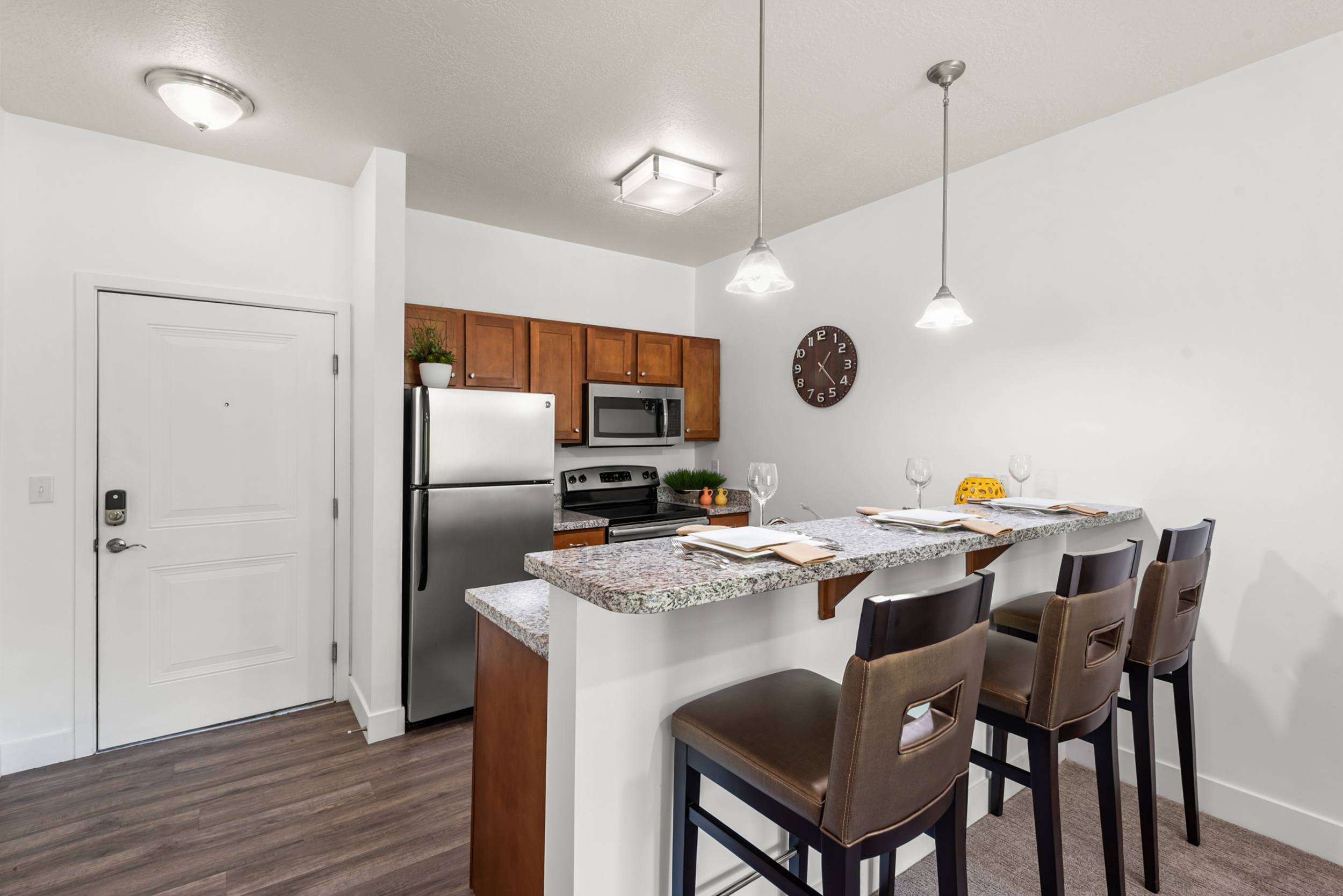 Open kitchen with breakfast bar and pendant lighting at Liberty Gateway Apartments, Utah, 84101