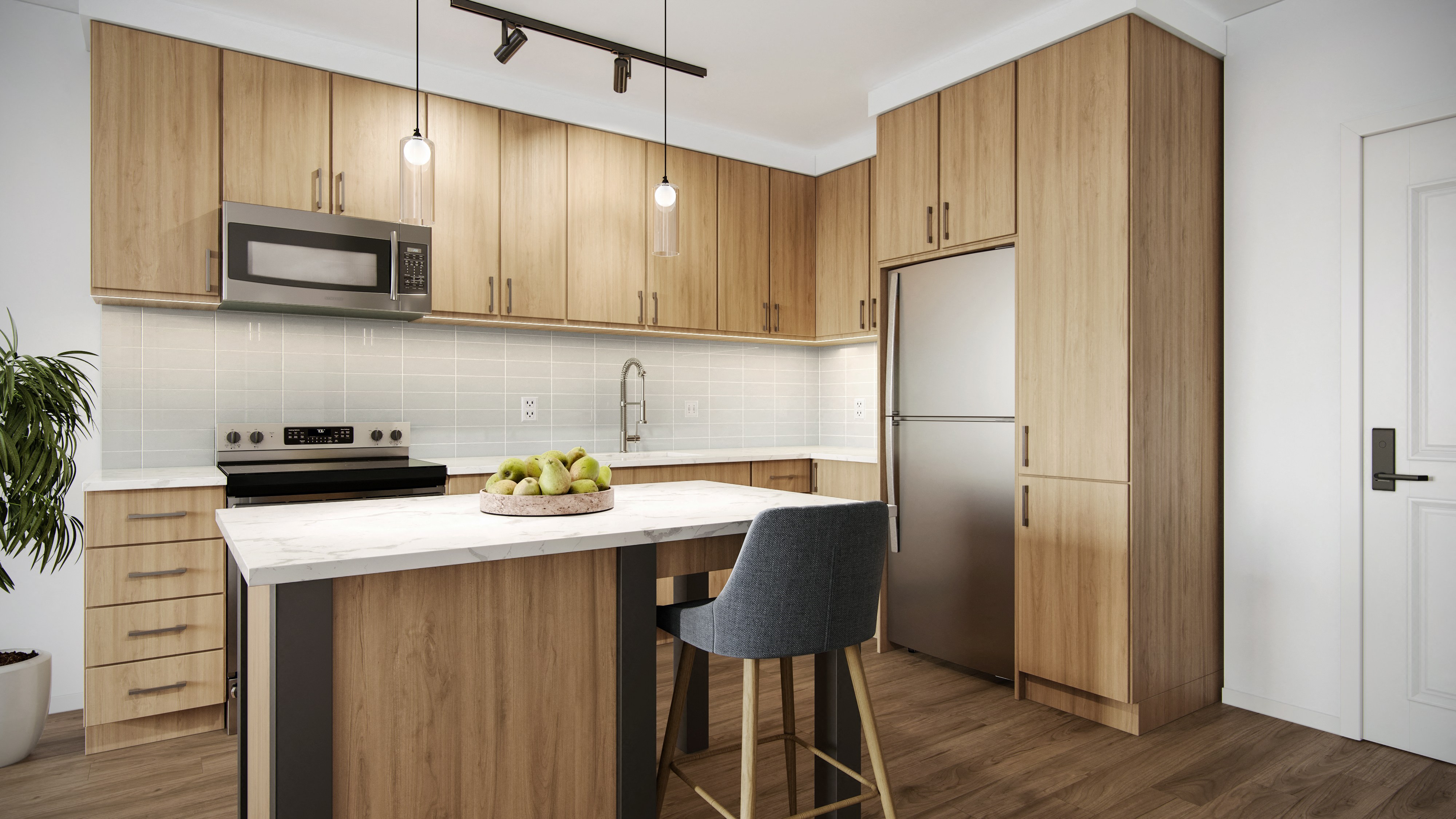 a kitchen with wooden cabinetry and a large island with a marble countertop