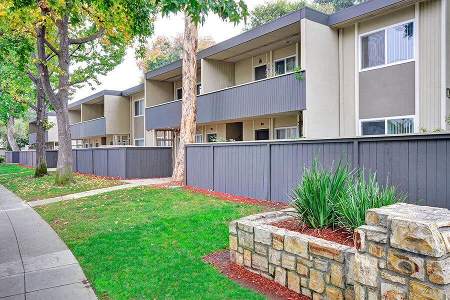 The exterior landscaping and walkways of the Trestles Apartments in San Jose, California.
