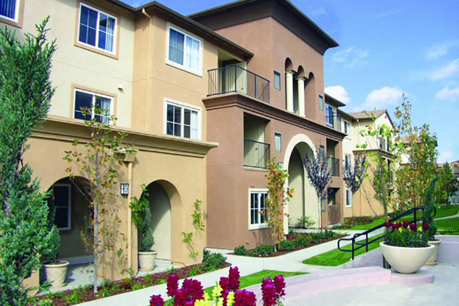 The exterior landscaping and walkways of the Muirlands at Windemere Apartments in San Ramon, California.