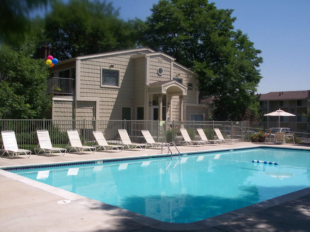 The community pool and lounge seating at Timberleaf Apartment Homes in Lakewood, Colorado.
