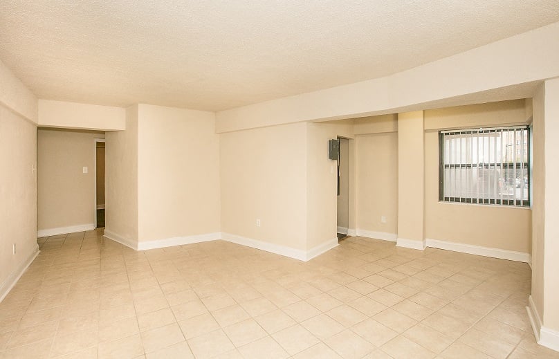 Alternate view of living room with tile floor at Sarbin Towers