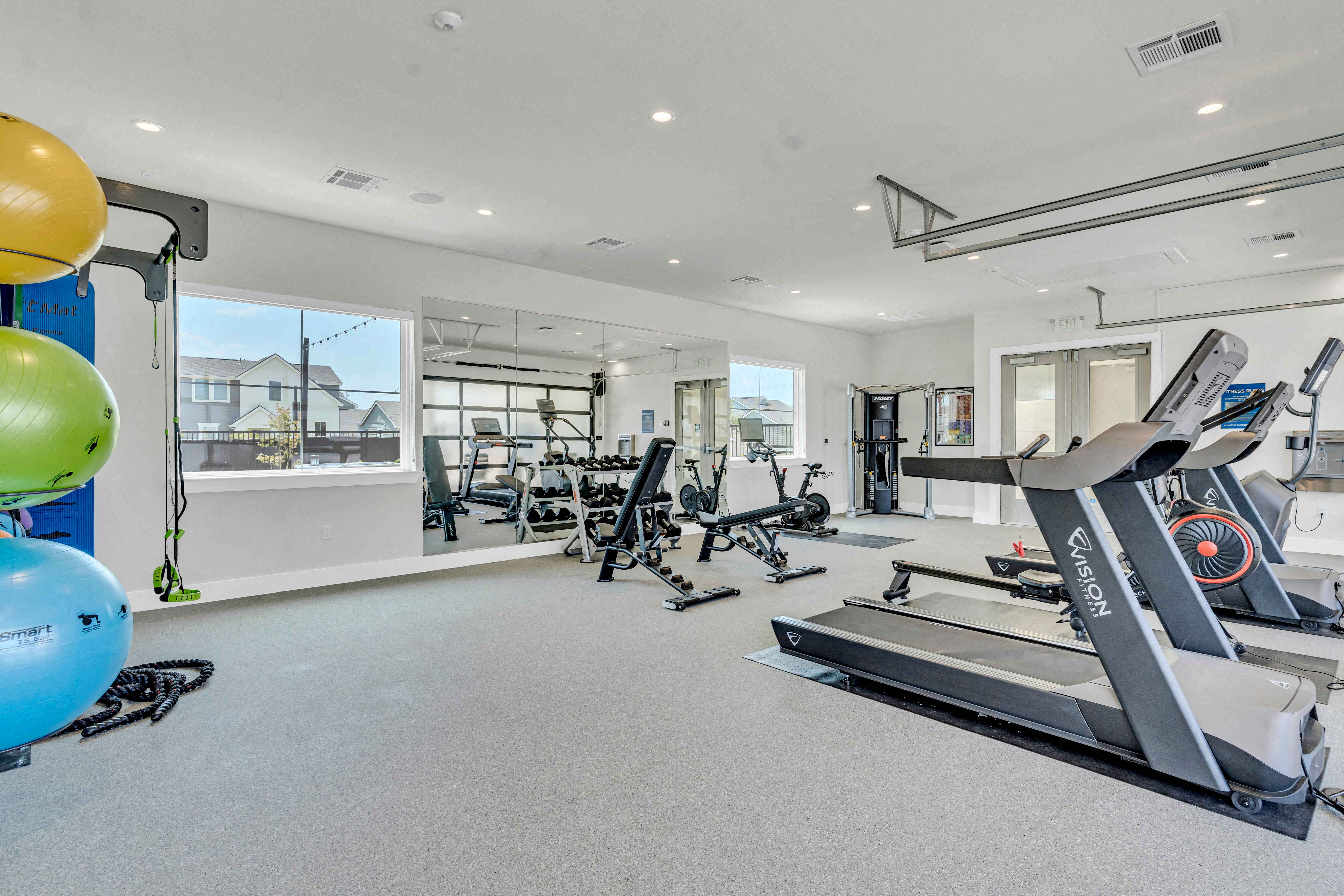 the gym at the district flats apartments in lenexa