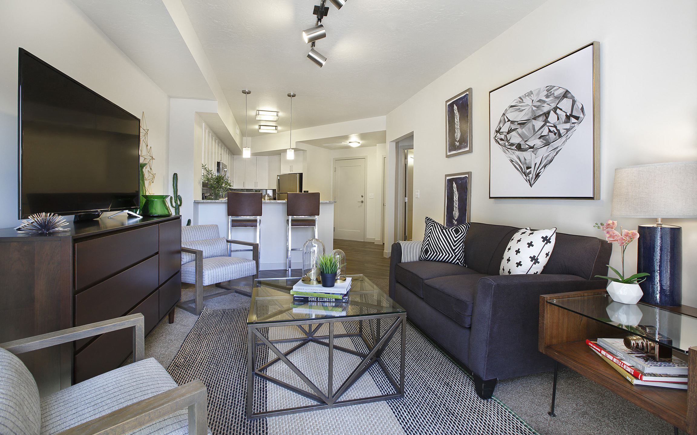 Modern living room with open kitchen layout at Liberty Blvd Apartments, Salt Lake City, UT