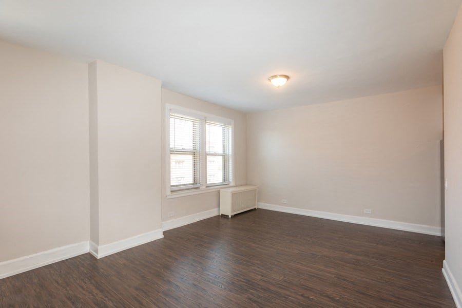 spacious living room hardwood floors renovated apartments hyde park chicago
